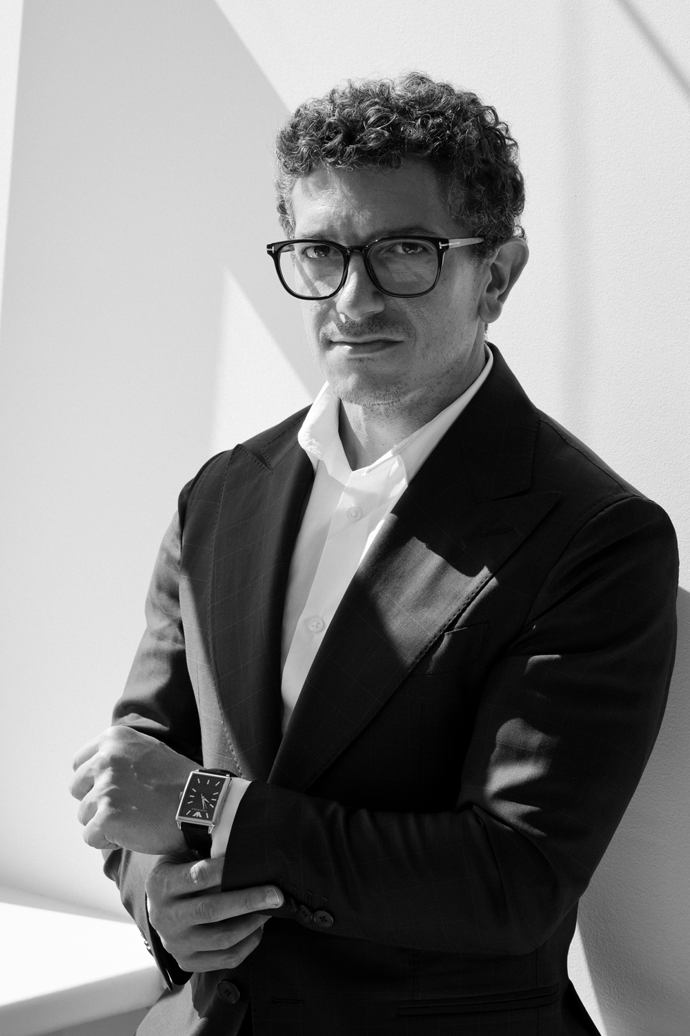 Matteo Russo in a black suit, editorial portrait